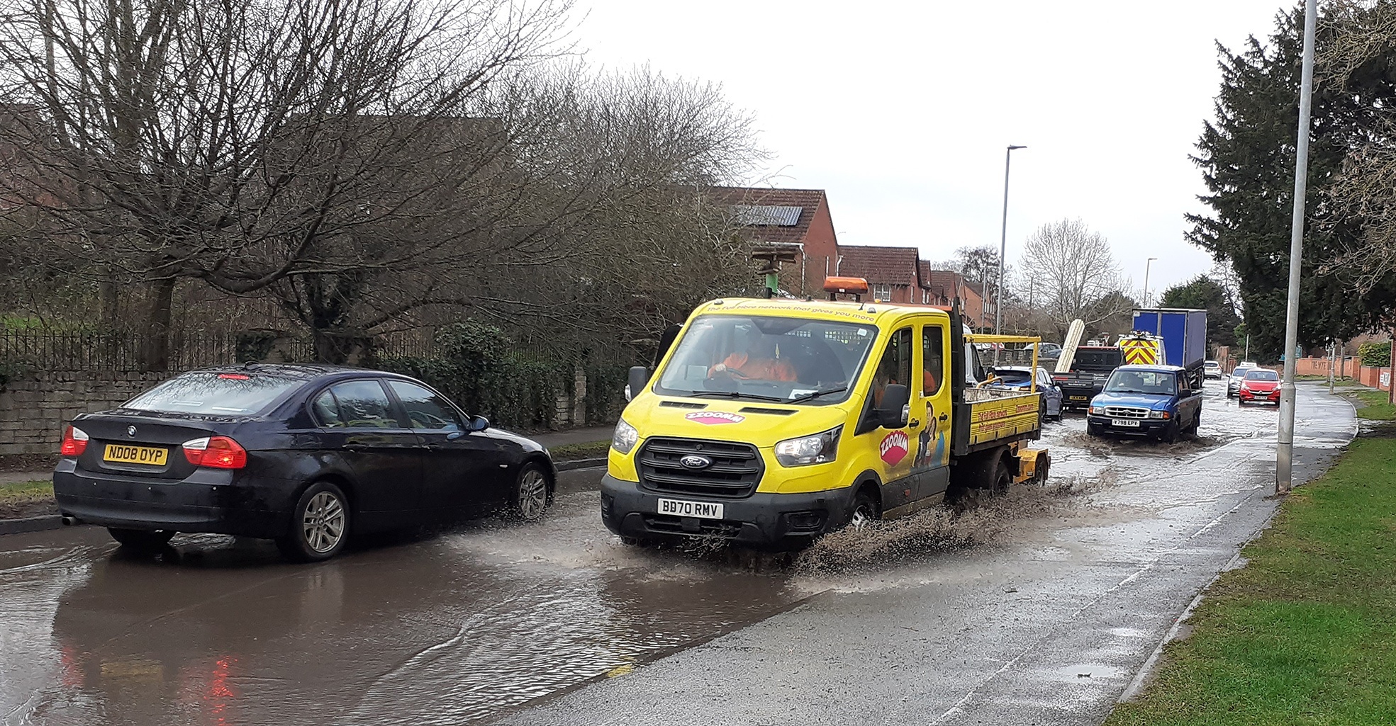 Vehicles on a flooded Holme Lacy Road