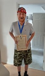 Conor holding his certificate