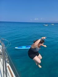 Heather jumping into the sea in Greece