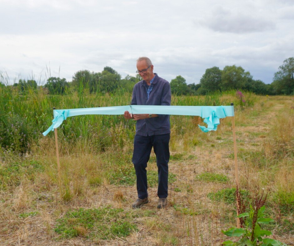 Kevin mccloud cutting ribbon