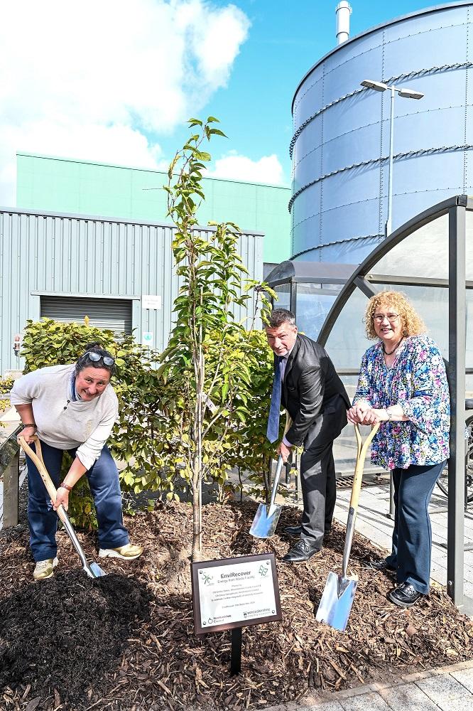 Cllr Elissa Swinglehurst, Steve Longdon and Cllr Emma Stokes planting a tree to commemorate the milestone.