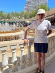 Paul by a fountain on holiday