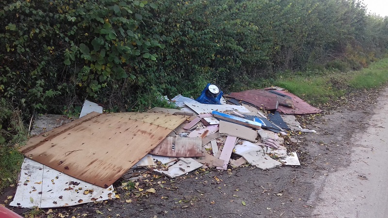 Fly tipped waste in Acton green